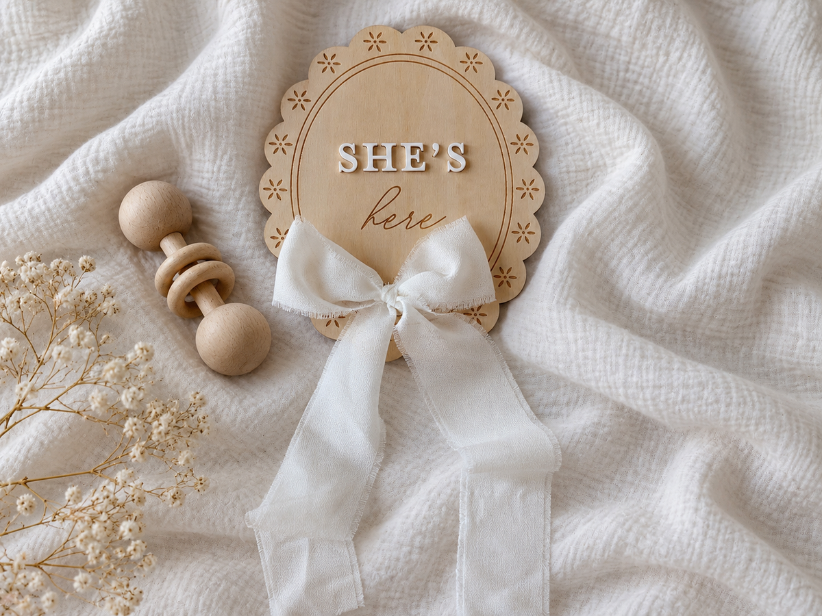 She's Here Sign